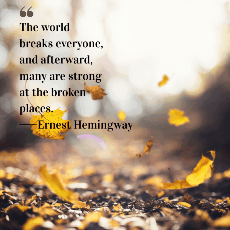 Close up of the ground covered in falling yellow leaves and dirt.