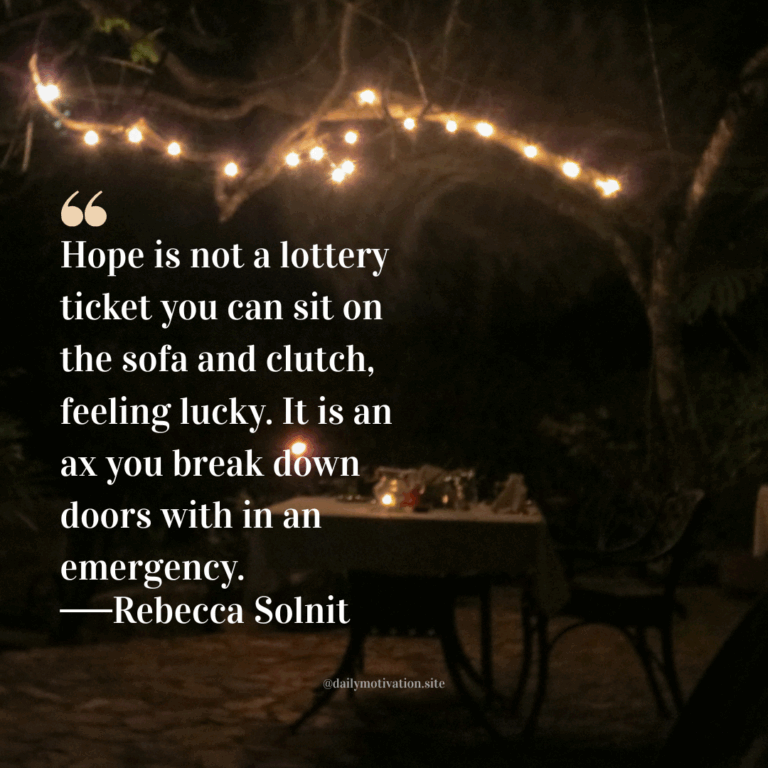 Cozy outdoor night scene with string lights over a table set for two.