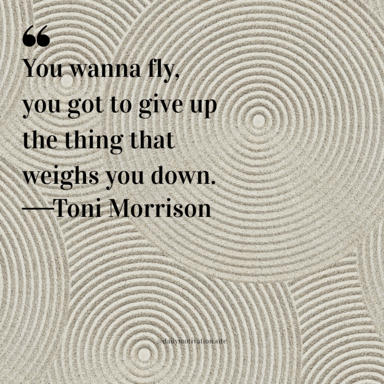 Beige sand garden with concentric circular patterns raked into the surface.