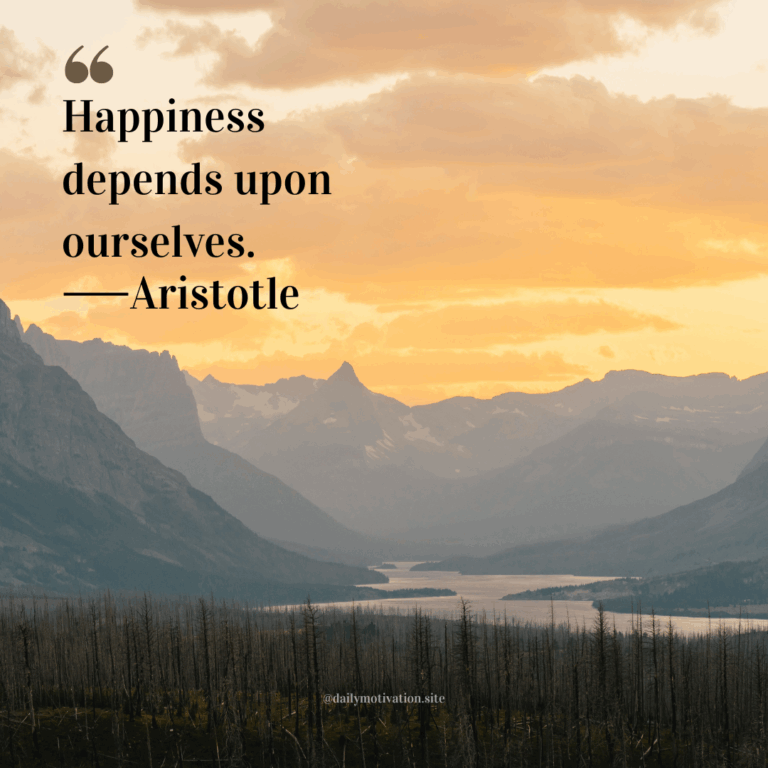 Golden sunrise over mountain peaks and a winding river valley.