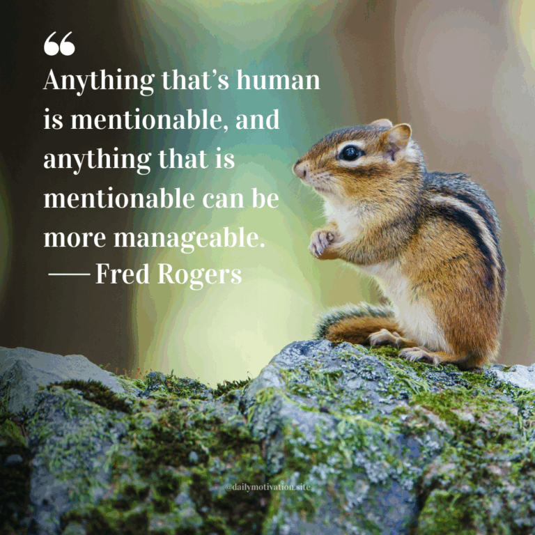 Chipmunk sitting on a moss-covered rock in a forest with soft green and yellow bokeh behind it.