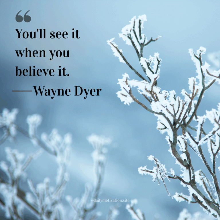 Frost-covered branches reaching toward a pale blue winter sky.