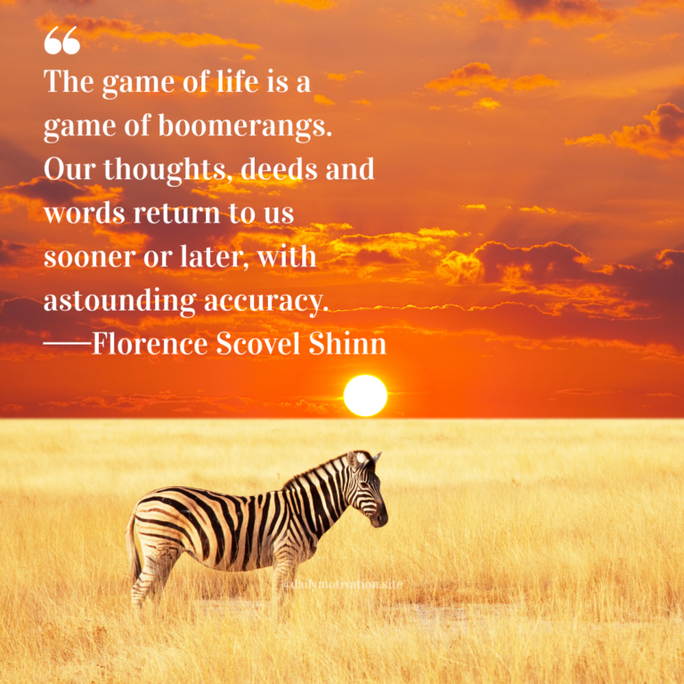 Zebra standing in tall golden grass at sunset beneath an orange sky.