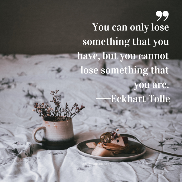 Neutral-toned bed scene with a ceramic mug, plate of pastries, and dried flowers on soft bedding.