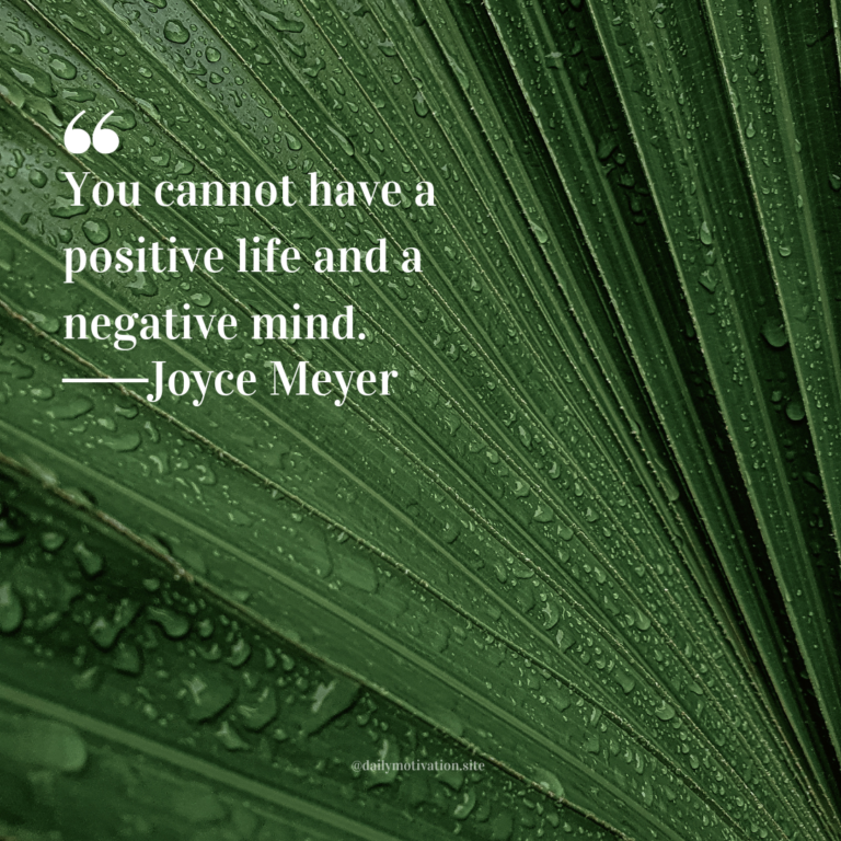 Close-up of a green leaf covered in water droplets with visible natural texture.