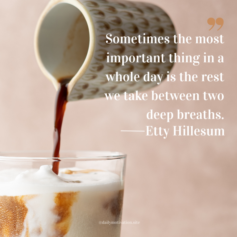 Coffee being poured from a patterned ceramic cup into a glass of milk, creating soft brown swirls against a warm neutral background.