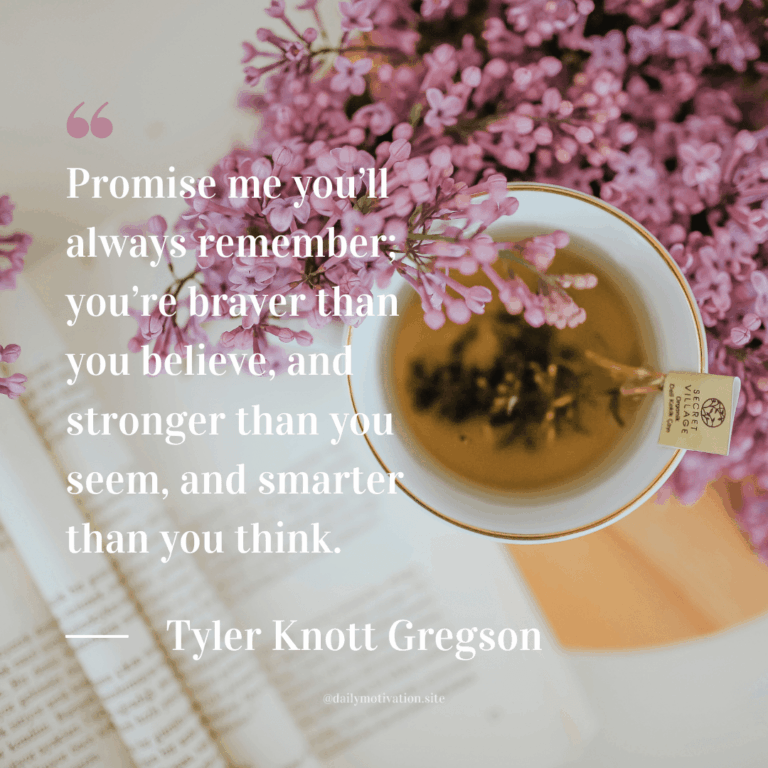 Cup of tea on an open book beside lilac flowers arranged on a light-colored surface.